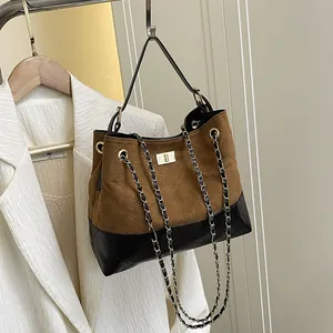 Retro contrast color shoulder bag with quilted texture and gold chain strap in brown