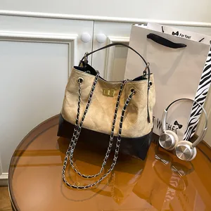 Contrast color rhombic quilted chain shoulder bag with khaki suede and black leather finish