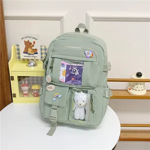 Zaino scuola verde menta con tasca trasparente e graziosi accessori per ragazze