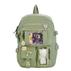 Zaino scolastico Oxford verde salvia per donna con tasche multiple e ciondolo di peluche