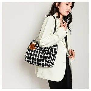 Large capacity black and white plaid wool shoulder bag with a cute brown plush pendant