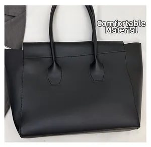 Close-up of the comfortable fabric and fine stitching on the black leather tote bag