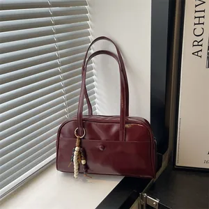Deep red retro bowling handbag for women with stylish wooden bead charm detail