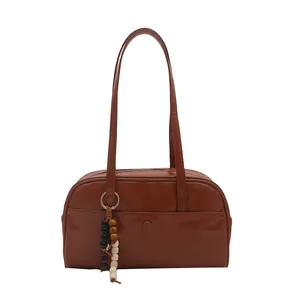 Vintage brown PU leather bowling handbag with beaded charm and gold ring detail