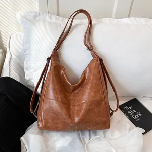 Caramel vintage leather Hobo bag with adjustable straps for shoulder or crossbody wear