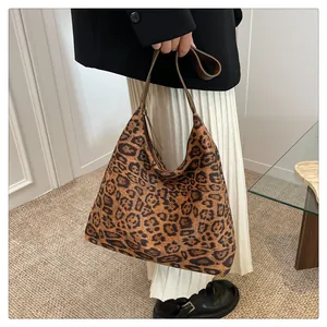 Leopard print hobo tote bag shown on model for daily commuting and fashion use