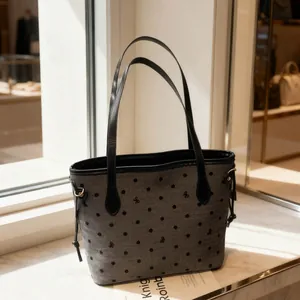Grey large-capacity tote bag with black polka dots and delicate bow pattern