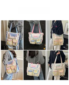Detail of colorful multi-pocket canvas crossbody bag with adjustable straps and top handle