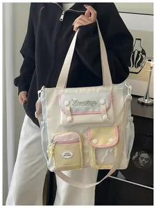 Detail of multi-pocket waterproof nylon crossbody bag in cream and pastel colors