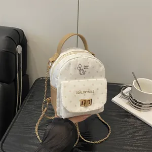 Polka dot mini backpack with cat print and gold chain strap for stylish travel