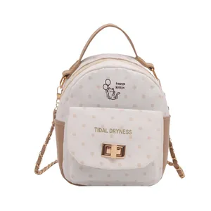 Polka dot mini backpack with cartoon cat print and dual-purpose metal chain straps