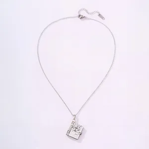 Detail of silver steel book pendant with pinky promise engraving and S925 stamp