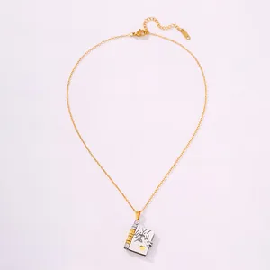 Detailed close-up of 18k gold-plated envelope book pendant necklace with heart engraving
