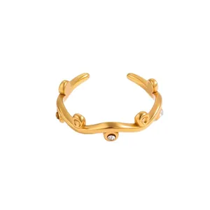 Adjustable golden stainless steel wave ring featuring multiple inlaid sparkling crystals