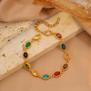 Pulsera de lujo en acero inoxidable dorado con piedras ovaladas de colores y cierre de langosta