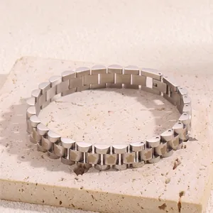 Detailed view of silver stainless steel strap bracelet with floral pattern on stone