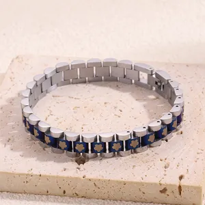 Detail of titanium steel watch-strap bracelet with blue links and gold flower motifs