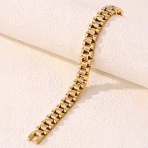 Detail shot of golden titanium steel bracelet with hollow flower links and watchband style