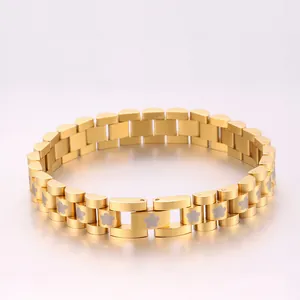 Detailed macro view of gold-plated stainless steel watch-style bracelet with flower motifs