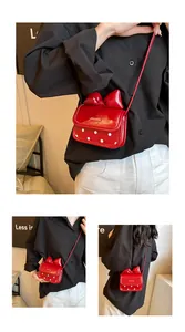 Détail du mini sac bandoulière rouge avec un grand nœud décoratif et motif à pois blancs