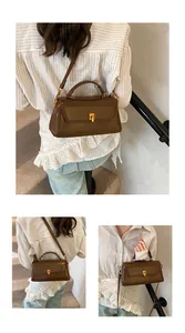 Detailed views of a brown leather square handbag with golden buckle and detachable strap