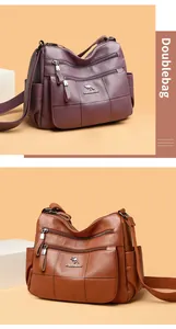 Detail of multi-zipper leather shoulder bags with litchi texture and adjustable straps