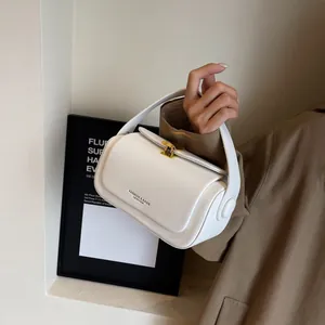 Minimalist white leather square handbag with golden clasp and fashion lettering