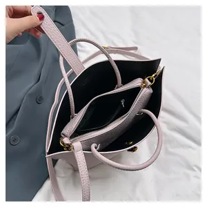 Top view of large pink tote bag interior showing the inner pouch and litchi texture