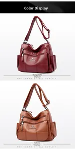 Detail of burgundy and brown lychee textured leather shoulder bags with multiple zippers