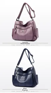 Detail view of purple and blue multi-pocket crossbody bags with lychee texture and logo