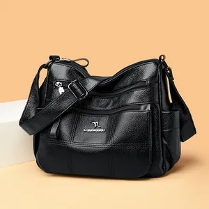Classic black leather crossbody bag with multi-pocket design and adjustable strap
