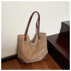 Handwoven straw tote bag with brown leather trim for summer beach vacations and daily leisure