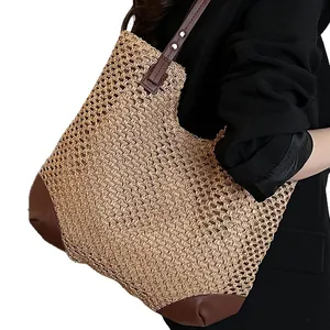 Summer woven straw tote bag with brown leather handles for beach vacation style