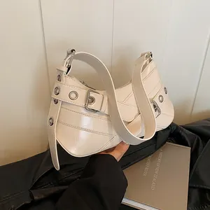 Chic creamy white underarm bag with silver eyelets and buckle in a retro Y2K biker style