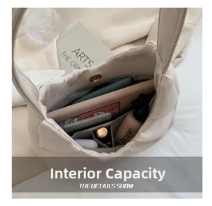 Internal capacity of the off-white soft leather shoulder bag with daily essentials