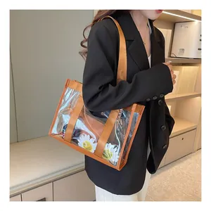 Transparent PVC tote bag with orange trim showing daisy patterns and internal storage space