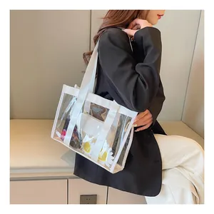 Detailed side view of clear PVC tote bag with white canvas straps on fashion model