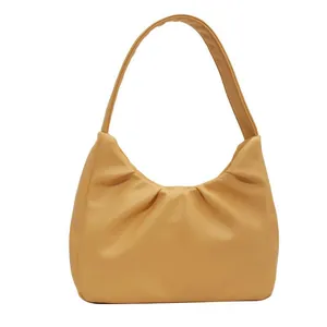 Pale yellow pleated cloud underarm bag made of premium PU leather with a sleek moon shape
