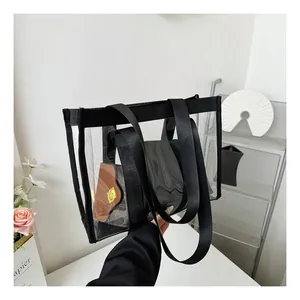 Detail of transparent PVC tote bag with black nylon straps and inner printed pouch