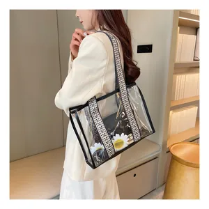 Detail of transparent PVC tote bag with wide ethnic shoulder strap and inner pouch