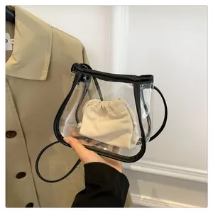 Detail view of transparent PVC crossbody bag with beige canvas drawstring inner pouch