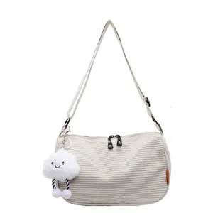 Minimalist white corduroy crossbody bag with adjustable strap and cute cloud charm