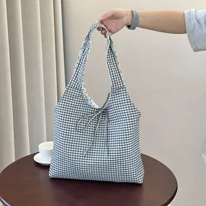 Blue gingham check tote bag with drawstring bow and floral lining for daily commute