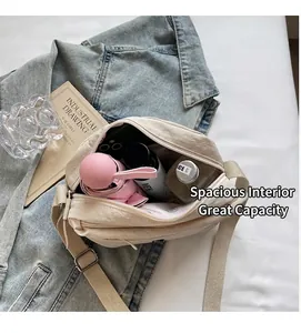 Top view of cream crossbody bag showing large storage capacity with daily items inside