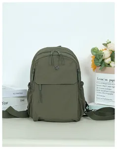 Olive green leisure backpack featuring dual-zipper main compartment and durable fabric texture