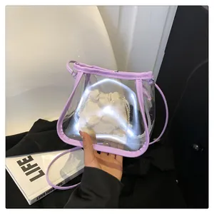 Close-up of light purple transparent PVC crossbody bag with drawstring liner pouch
