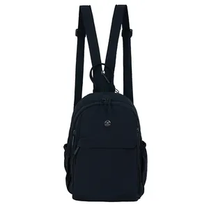 Minimalist black lightweight nylon backpack with metal M logo for daily outdoor commute
