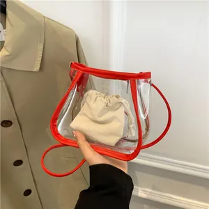 Transparent PVC mini crossbody bag with red leather trim and canvas inner pouch