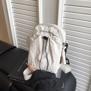 Japanese style cream white nylon crossbody phone bag with drawstring front pocket