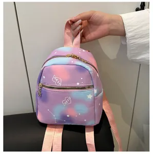 Detailed view of mini backpack featuring pink and purple starry gradient with love hearts